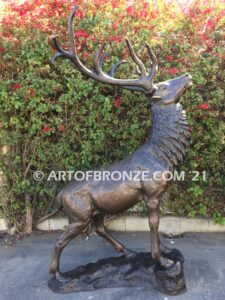 Unyielding Terrain Heroic bronze bull elk standing on rocky base design with head raised in bugling position