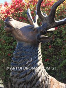 Unyielding Terrain Heroic bronze bull elk standing on rocky base design with head raised in bugling position