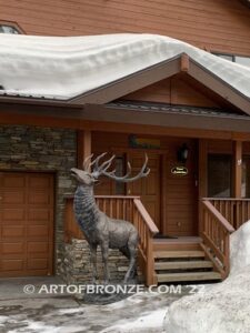 Unyielding Terrain Heroic bronze bull elk standing on rocky base design with head raised in bugling position