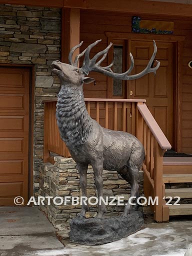 Unyielding Terrain Heroic bronze bull elk standing on rocky base design with head raised in bugling position