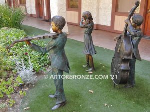 Virtuoso Pals wonderful outdoor bronze sculpture featuring three children playing music concert