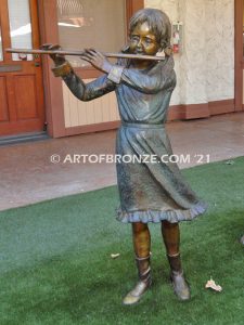 Virtuoso Pals wonderful outdoor bronze sculpture featuring three children playing music concert
