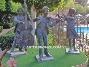 Virtuoso Pals wonderful outdoor bronze sculpture featuring three children playing music concert