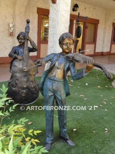 Virtuoso Pals wonderful outdoor bronze sculpture featuring three children playing music concert