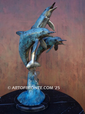 Water Play three dolphins playfully swimming together bronze sculpture