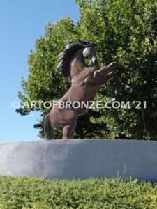 Wild Country sculpture of reared horse with forelegs off the ground and hind legs attached bronze base