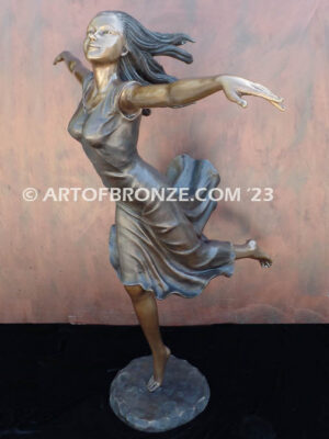 Wind Swept bronze statue joyous woman gracefully balancing on one foot