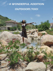 Wind Swept bronze statue joyous woman gracefully balancing on one foot