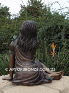 Wings of Joy bronze sculpture of sitting girl in dress with bronzes butterflies