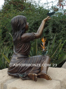 Wings of Joy bronze sculpture of sitting girl in dress with bronzes butterflies