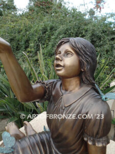 Wings of Joy bronze sculpture of sitting girl in dress with bronzes butterflies