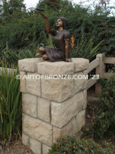 Wings of Joy bronze sculpture of sitting girl in dress with bronzes butterflies