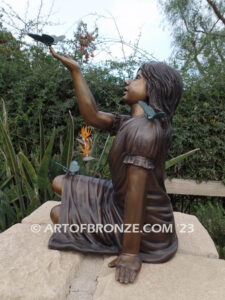 Wings of Joy bronze sculpture of sitting girl in dress with bronzes butterflies