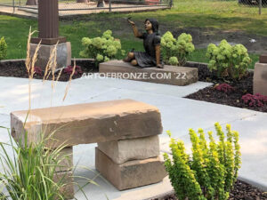 Wings of Joy bronze sculpture of sitting girl in dress with bronzes butterflies