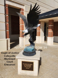 Colleyville Municipal Court Eagle of Justice outdoor monumental statue of an eagle landing atop granite pillar