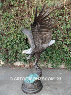 Majesty monumental bronze sculpture of eagle landing on branch