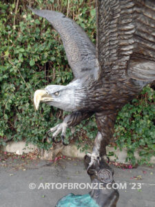 Majesty monumental bronze sculpture of eagle landing on branch