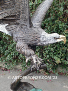 Majesty monumental bronze sculpture of eagle landing on branch