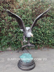 Majesty monumental bronze sculpture of eagle landing on branch