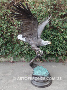 Majesty monumental bronze sculpture of eagle landing on branch