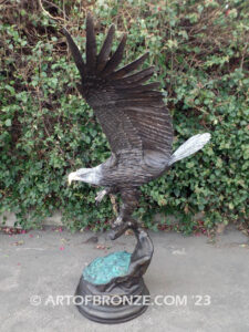 Majesty monumental bronze sculpture of eagle landing on branch