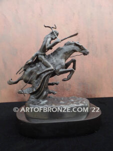 The Cheyenne bronze sculpture after Frederic Remington featuring warrior on galloping horse