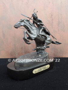 The Cheyenne bronze sculpture after Frederic Remington featuring warrior on galloping horse