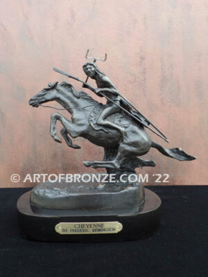 The Cheyenne bronze sculpture after Frederic Remington featuring warrior on galloping horse