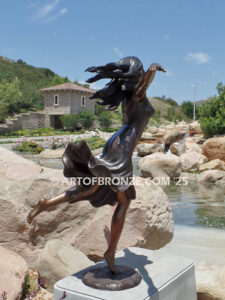 Wind Swept bronze sculpture joyous woman gracefully balancing on one foot