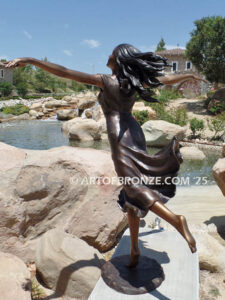 Wind Swept bronze sculpture joyous woman gracefully balancing on one foot