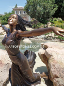 Wind Swept bronze sculpture joyous woman gracefully balancing on one foot