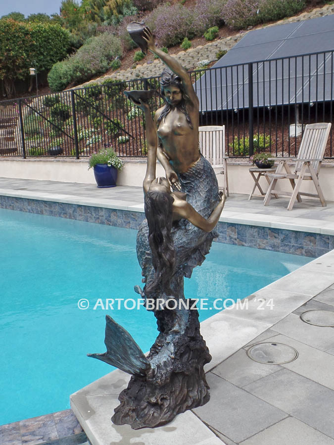 Poseidons Temptation two mermaids holding oyster shell bronze statue fountain