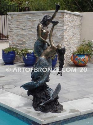 Bronze mermaid sculpture holding oyster shell for pond, pool or aquatic display