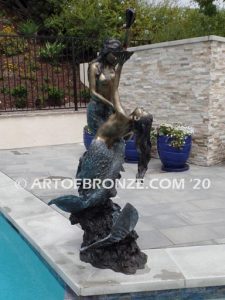 Bronze mermaid sculpture holding oyster shell for pond, pool or aquatic display