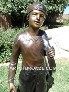 Practice makes Perfect bronze sculpture of junior golfer practicing for USPGA