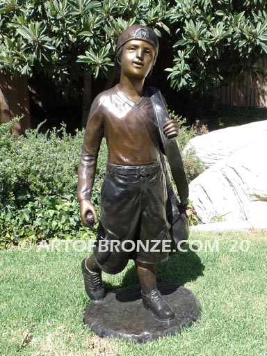 Practice makes Perfect bronze sculpture of junior golfer practicing for USPGA