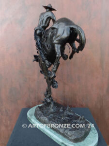 Outlaw bronze sculpture cowboy on bucking horse after Frederic Remington