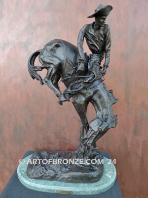 Outlaw bronze sculpture cowboy on bucking horse after Frederic Remington