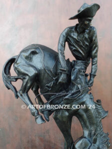 Outlaw bronze sculpture cowboy on bucking horse after Frederic Remington
