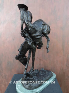 Outlaw bronze sculpture cowboy on bucking horse after Frederic Remington