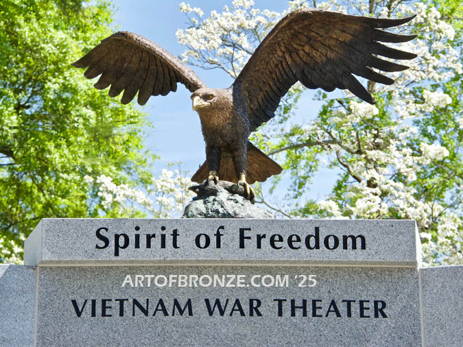 Vietnam War Memorial outdoor monumental bronze statue of an eagle landing atop granite pillar