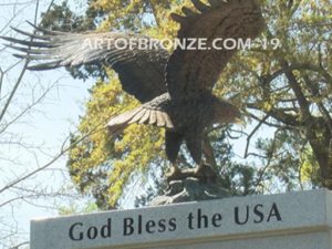 Vietnam War Memorial outdoor monumental statue of an eagle landing atop granite pillar