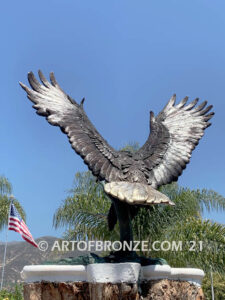 Thunder and Lightning monumental bronze eagle statue anchored a top a massive tree