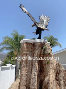 Thunder and Lightning monumental bronze eagle statue anchored a top a massive tree