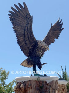 Thunder and Lightning monumental bronze eagle statue anchored a top a massive tree