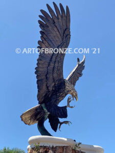 Thunder and Lightning monumental bronze eagle statue anchored a top a massive tree