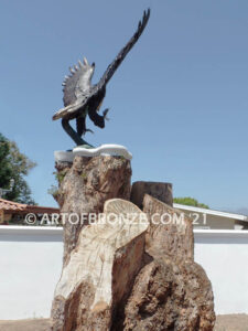 Thunder and Lightning monumental bronze eagle statue anchored a top a massive tree