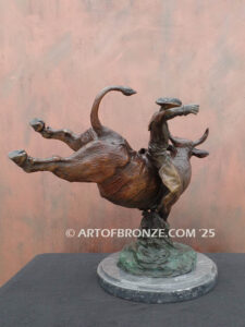 All on the Line bronze sculpture of rider atop bull attached to a marble base