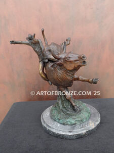 All on the Line bronze sculpture of rider atop bull attached to a marble base