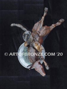 All on the Line sculpture of bull rider riding jumping bull attached to a marble base